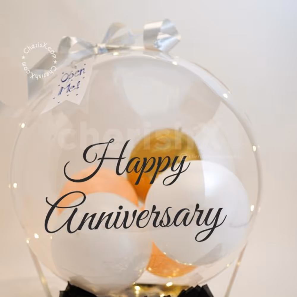 A Bubble Balloon with Golden Chrome, White Latex and Pastel Peach balloon inside.