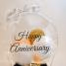 A Bubble Balloon with Golden Chrome, White Latex and Pastel Peach balloon inside.