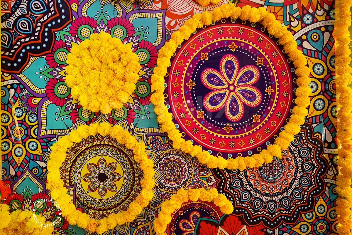 CherishX's Diwali Decoration with 2 pots decorated with 2 yellow Flower Garlands and Green leafs.