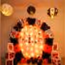 A beautifully curated Decor made with an arch of black and red latex balloons for your card party.