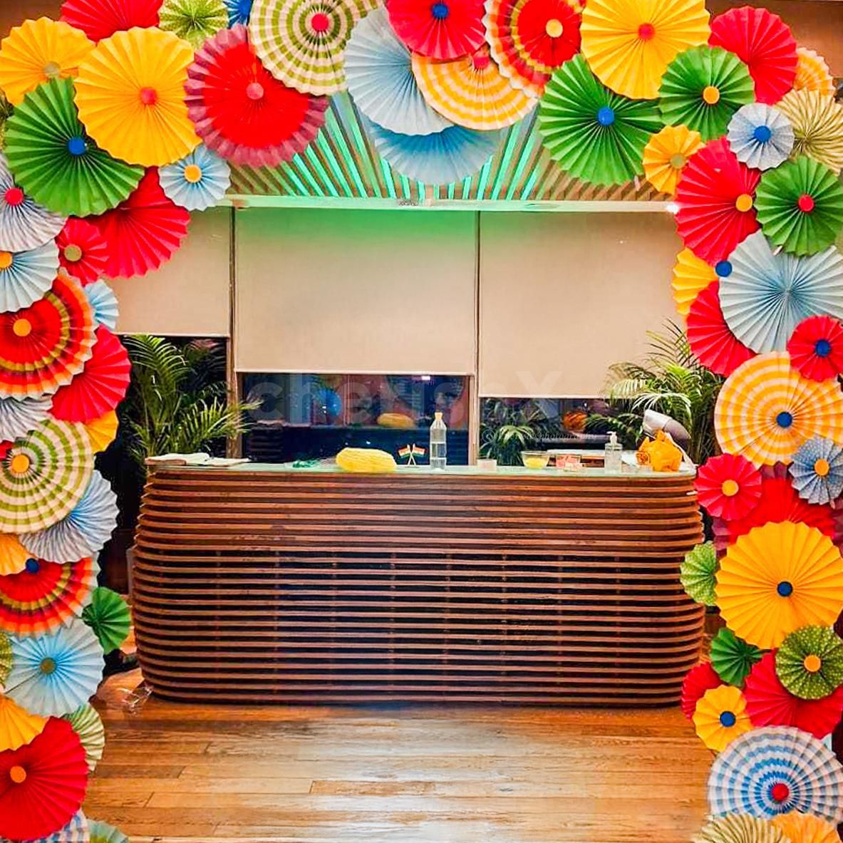 Vibrant decor that gives the reception area a colourful makeover with paper rosettes