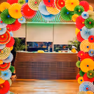Vibrant decor that gives the reception area a colourful makeover with paper rosettes