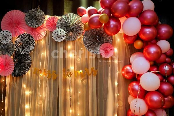 Bridal Shower Balloon Decoration with Balloons in Pink Shade and Rosettes.