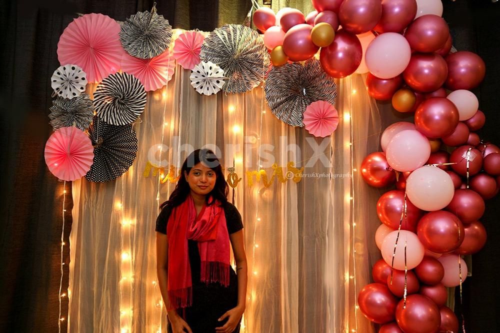 The Bridal Shower Decor with Balloon Arc on one side and Rosettes on the other.