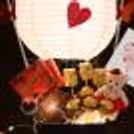 Surprise your partner this Valentine's Day with CherishX's Exclusive Chocolate Parachute Bucket Gift!