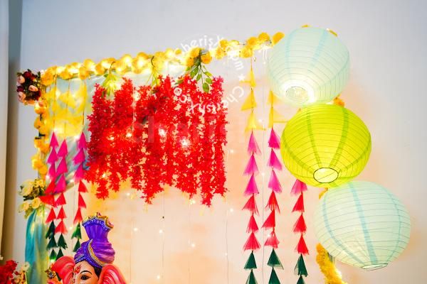 Garlands hanging from the ceiling for decorting the walls of the home for Ganesh Chaturthi!