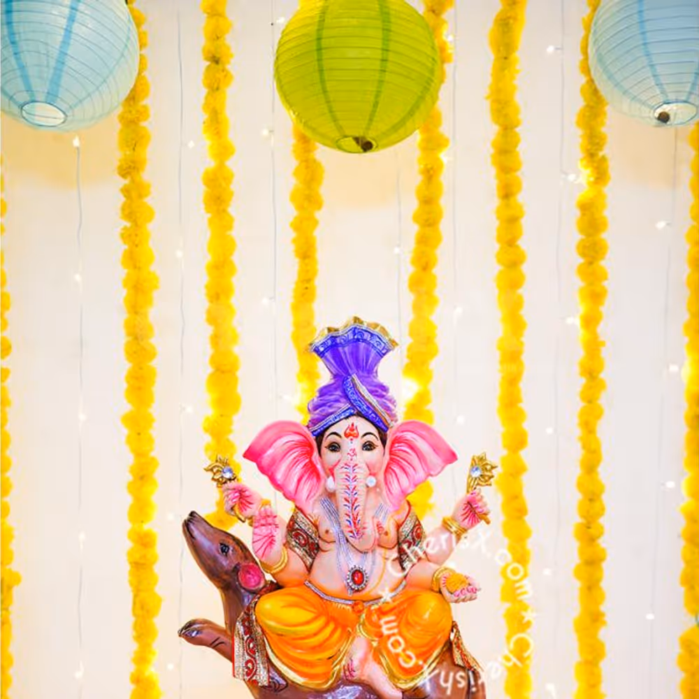 Get a Ganpati Marigold Decor at your home with CherishX.
