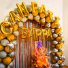 An arch made of Golden and Silver balloons, giving the decor a brighter look.