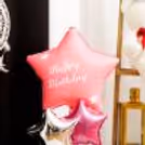 The pastel-pink-shaped balloon adds a unique elegance to this gifting item
