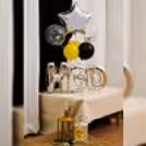 A striking silver birthday balloon bouquet will surprise your loved one
