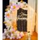 Pastel purple and white anniversary decoration with an elegant mesh backdrop
