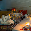 An intimate dining experience with candles, balloons, and more