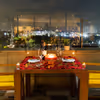 Candlelight and balloon-decorated table for an enlightening open-air dinner experience