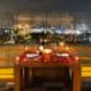 Candlelight and balloon-decorated table for an enlightening open-air dinner experience