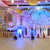 Transform the stage with an illuminated balloon and butterfly haven