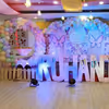 Transform the stage with an illuminated balloon and butterfly haven