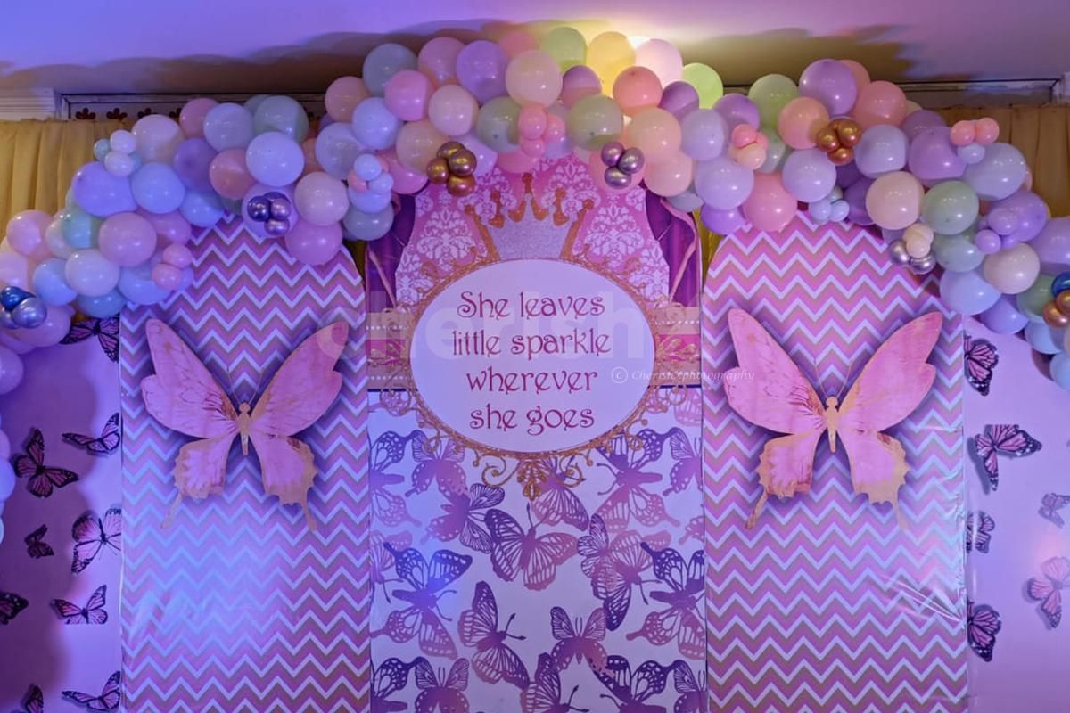 A colourful chrome backdrop illuminates the birthday aura