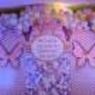 A colourful chrome backdrop illuminates the birthday aura