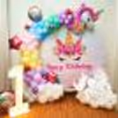 Magical unicorn-themed ring birthday decoration with colourful balloons