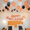 The text engraved in rose gold foil with black white and rose gold balloons hanging from the ceiling just lights up the ambience