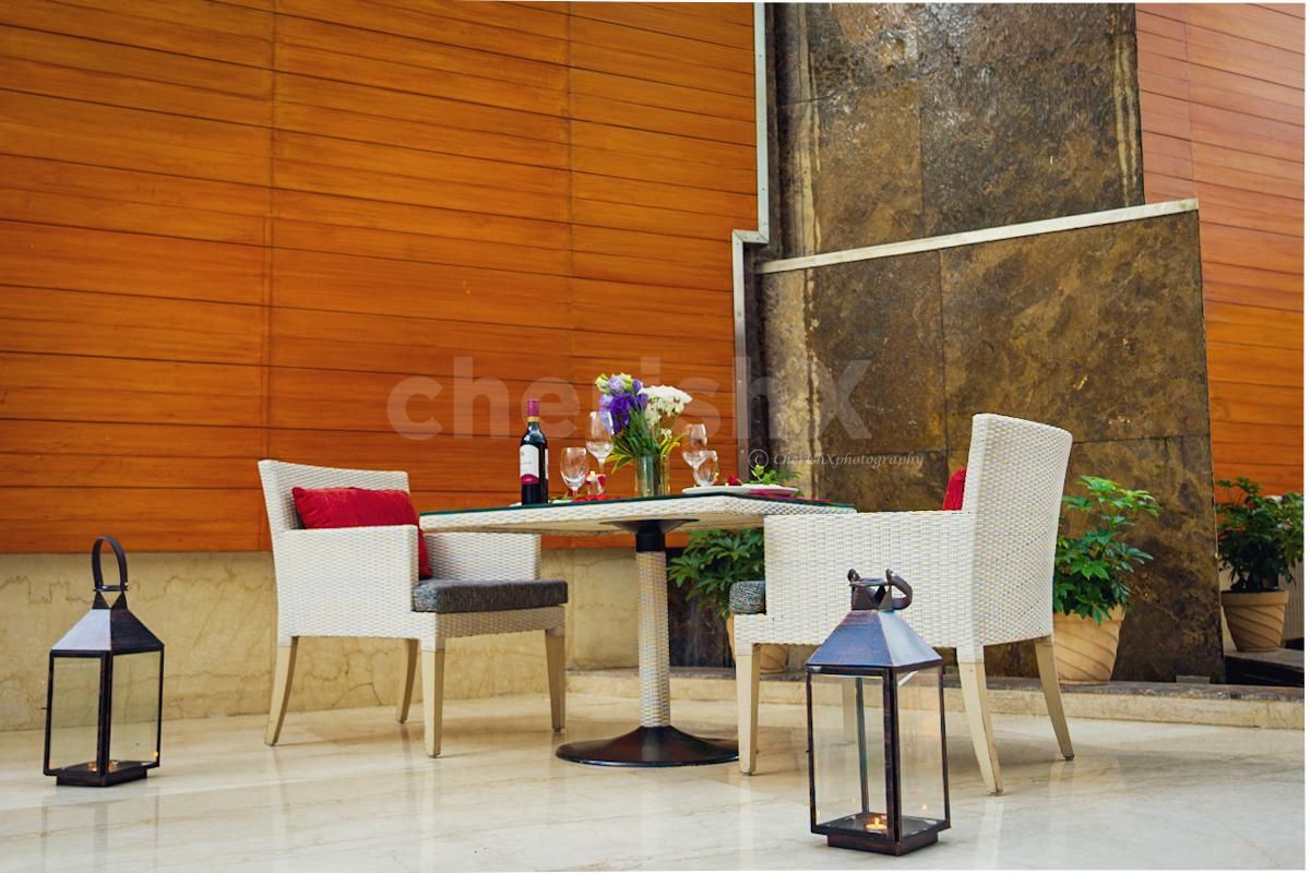 The flower bouquet only adds to the charm of a fountain and dinner date