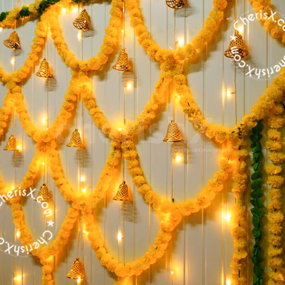 A mix of yellow and green garland around the wall will set the perfect pooja atmosphere