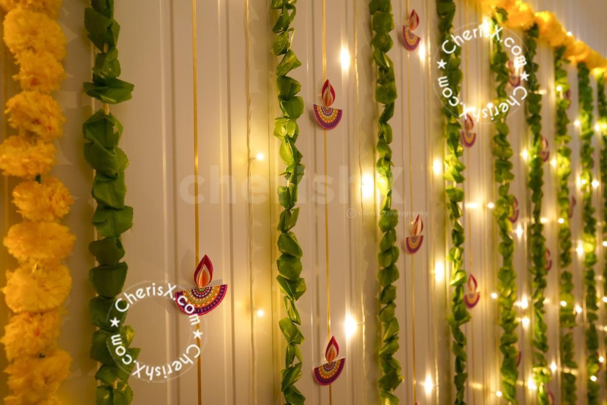 Celebrate the Diwali festival with diyas, garlands, and lights.