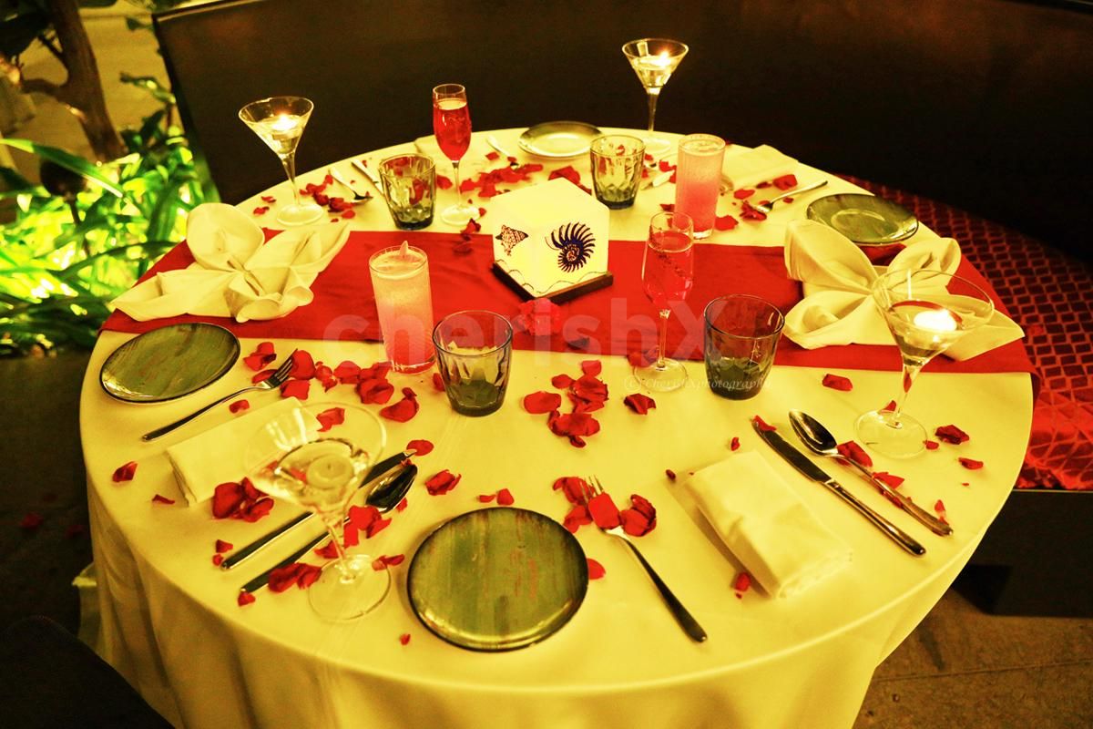 Rose petals, candles, and some wine for a romantic evening!