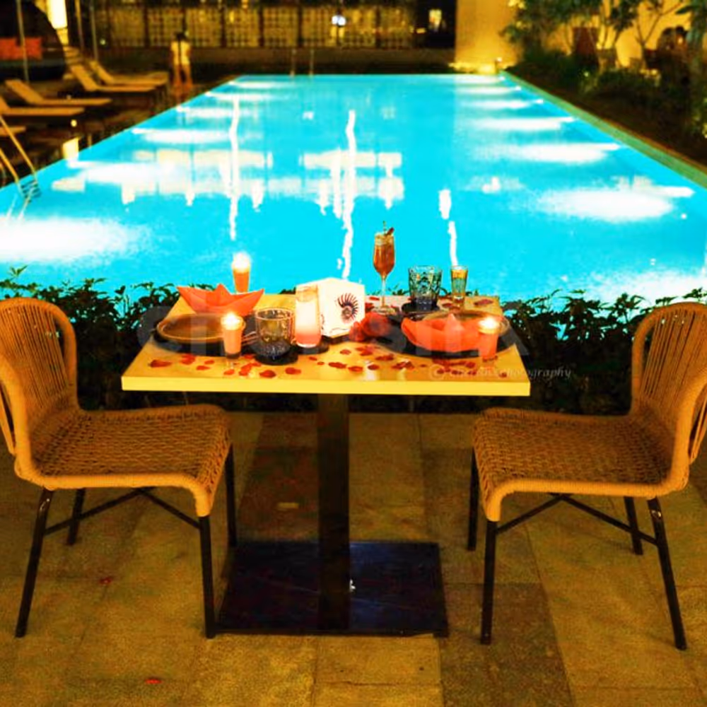 The beautiful surroundings guarded by the blue waters of the pool make this diner even more romantic