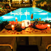 The candles and rose petals added to your poolside table adds love to the air