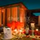 Beautifully decorated fountain-side dinner table for a romantic Karwa Chauth celebration.