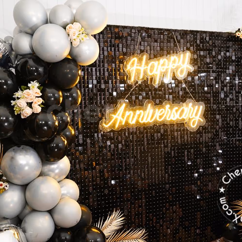 The happy anniversary neon light is the central attraction of any party.
