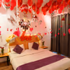 The red roses and balloons make the night romantic