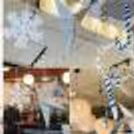 This cheerful display of hangings on the celling adds color and joy to Xmas night