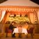 The decorated venue with candles and flowers makes the celebration special