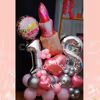 Make it extra festive with a balloon bouquet in pink and silver.