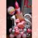 Make it extra festive with a balloon bouquet in pink and silver.