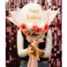 The pink and white flower arrangement is elegant and classy
