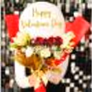 Romance this anniversary with this elegant bouquet of flowers and balloons