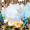 The pastel balloons in the bouquet are charming for the birthday occasion