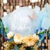 The pastel balloons in the bouquet are charming for the birthday occasion