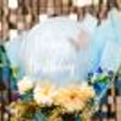 The pastel balloons in the bouquet are charming for the birthday occasion