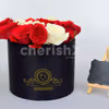 A bucket, full of red roses in which the letter is highlighted with white roses.