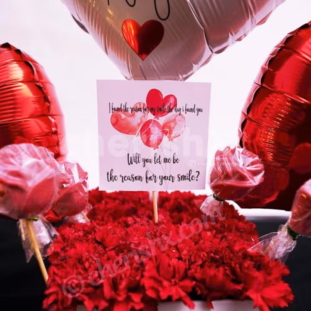 Surprise your loved one with CherishX's White & Red Colored Rose Day Bucket!