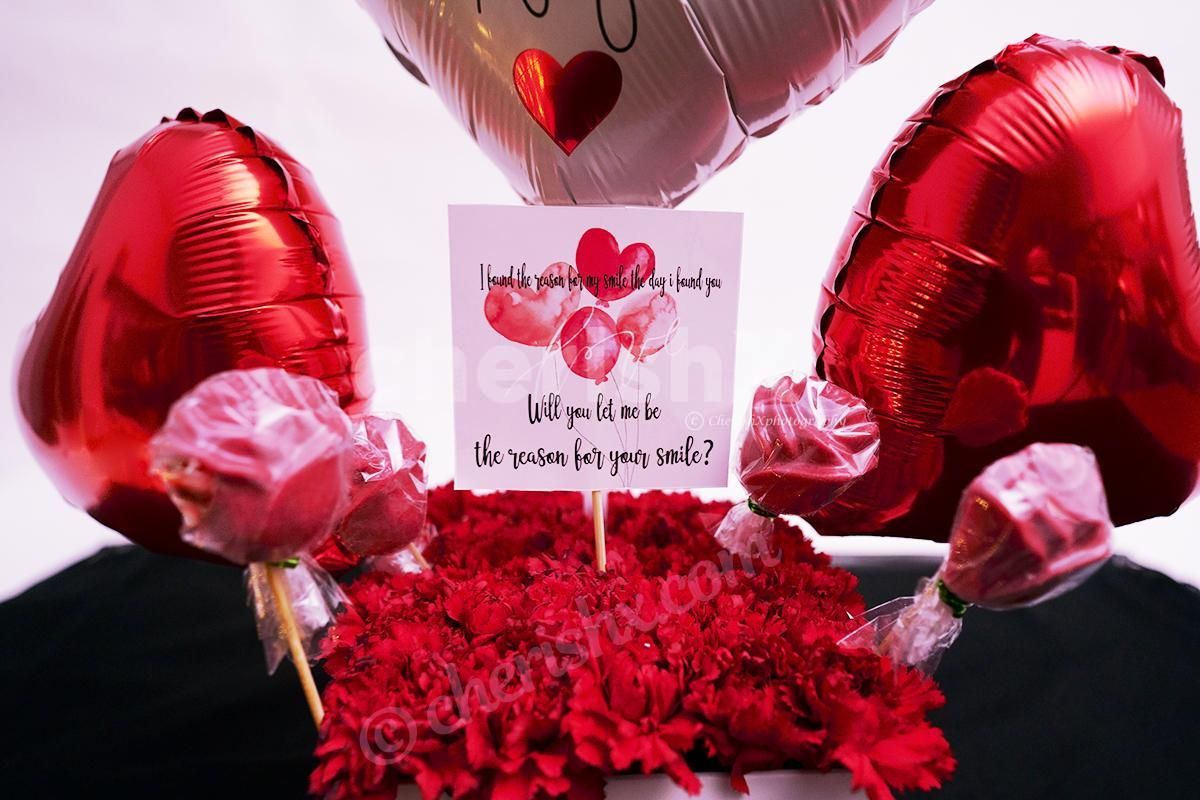 Surprise your loved one with CherishX's White & Red Colored Rose Day Bucket!