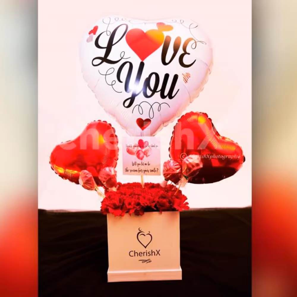 A captivating Red Carnations Love Balloon Bucket to captivate your loved one's heart!