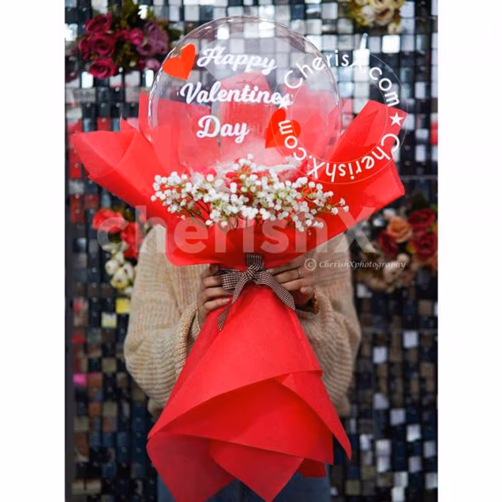 The balloon bouquet is unique with flowers and added accessories