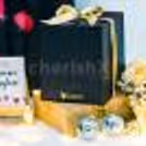 A cute mug hamper filled with warm hugs and heartfelt surprises.