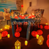 The decorations with roses and candles set the romantic vibe.