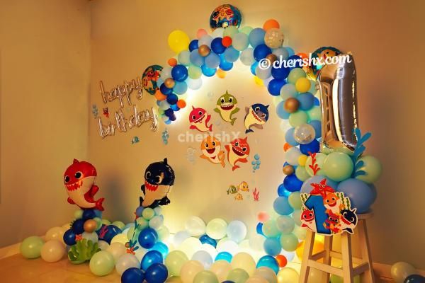 Baby Shark Paper Cut-outs and Balloon arc to enhance the Room Decoration.